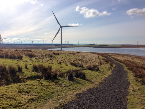 Whitelee Windfarm in Glasgow, wind turbines beside a loch